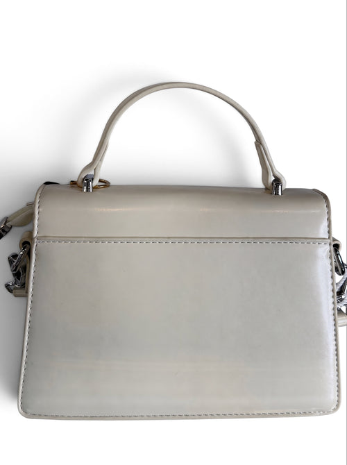 Zimoras Boutique ivory vegan leather top handle crossbody bag with silver hardware and structured silhouette