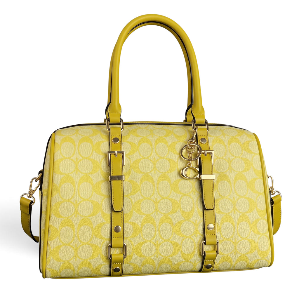 Zimoras Boutique yellow monogram satchel with leather trim and gold hardware, featuring a playful, chic design.